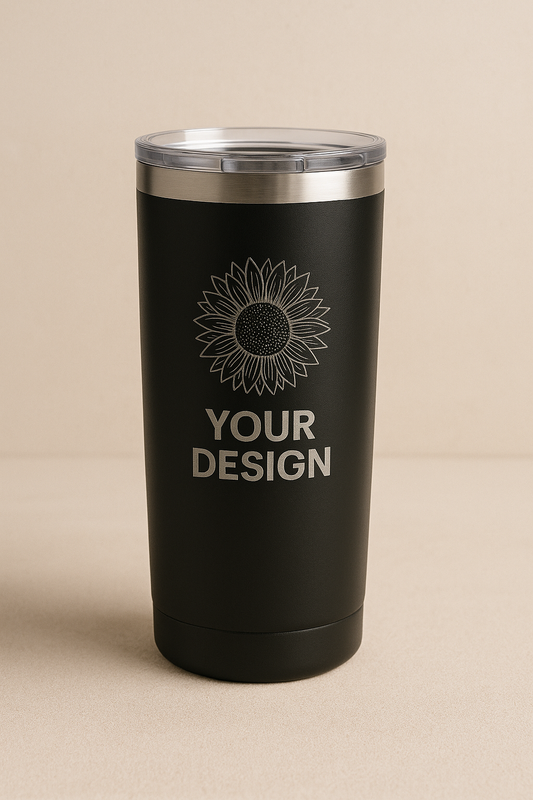 Black tumbler with silver lid on a beige background