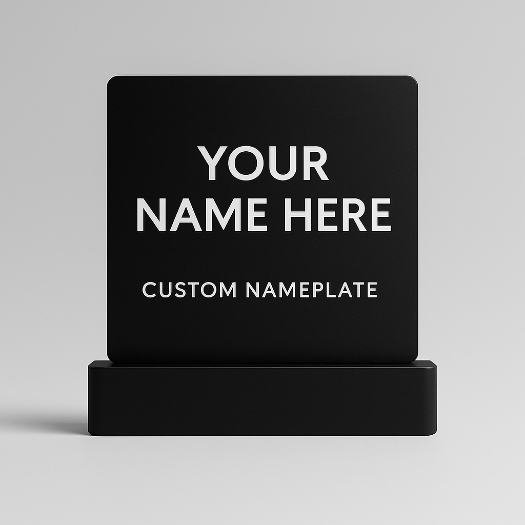 Black custom nameplate with 'Your Name Here' text on a gray background